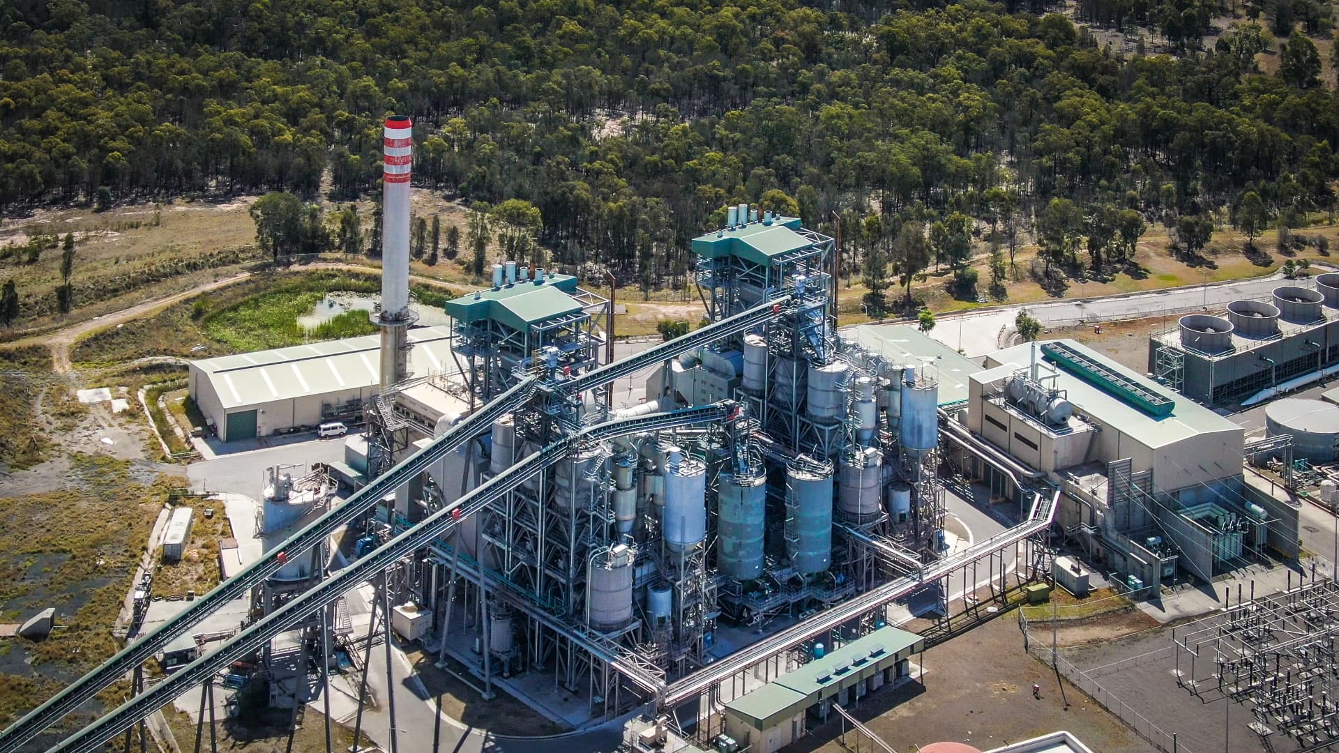 Aerial view of Redbank Power Station showing the fuel conveyor, silos, cooling towers and switchyard